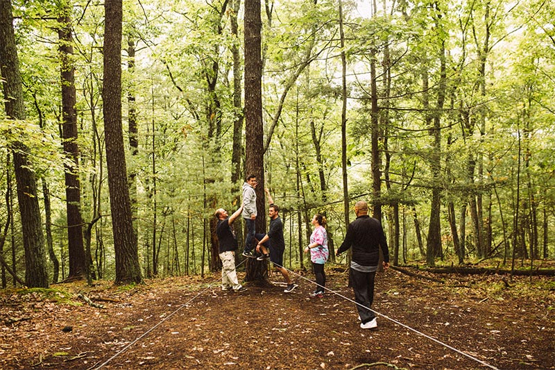 People on low ropes course