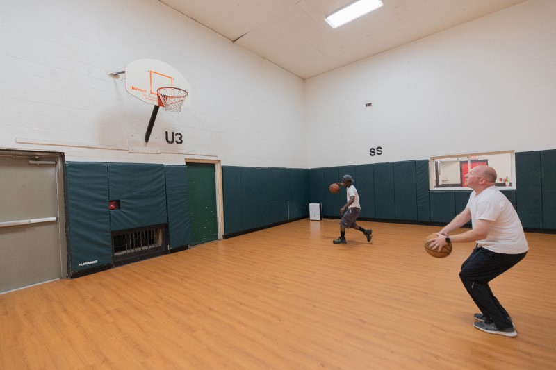 Two patients play basketball in the gym at White Deer Run of Allenwood