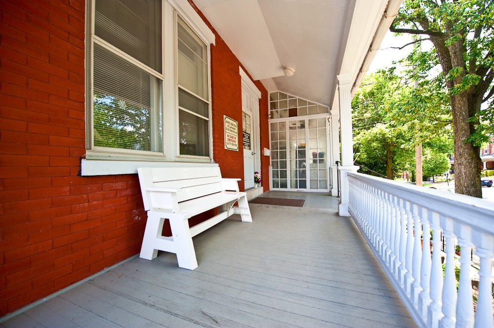 A bench on the front porch at White Deer Run Lancaster